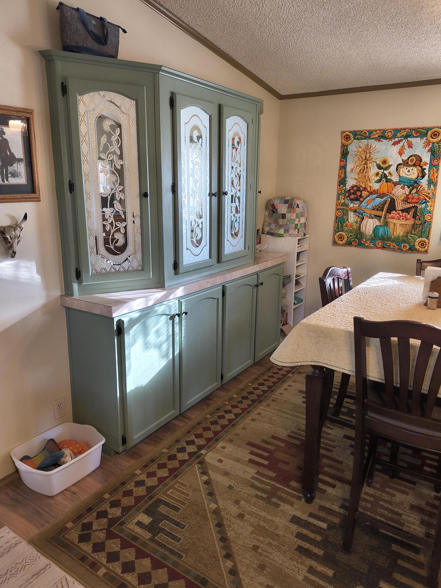 235 North Roosevelt Street Merrill, OR 97633 - Photo 8 of 27 a view of a dining room with furniture and wooden floor