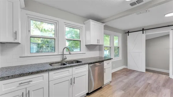 a kitchen with a sink and window