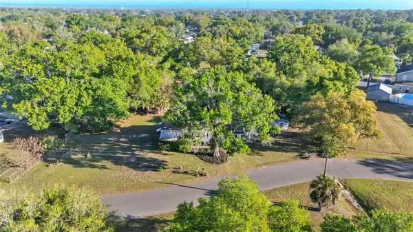 an aerial view of residential house with an outdoor space