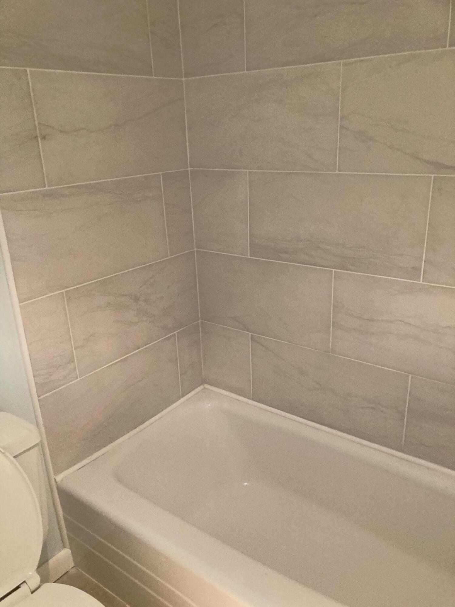 11811 Ave Of The PGA, Unit 21C Palm Beach Gardens, FL 33418 - Photo 16 of 30 a bathroom with a shower