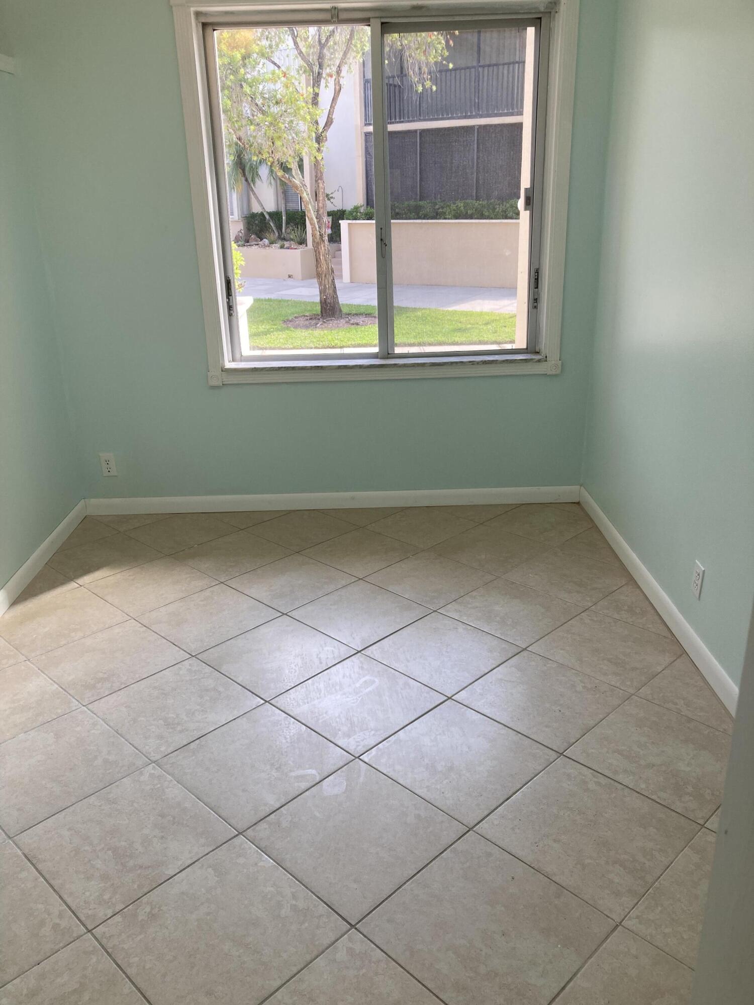 11811 Ave Of The PGA, Unit 21C Palm Beach Gardens, FL 33418 - Photo 21 of 30 an empty room with a window