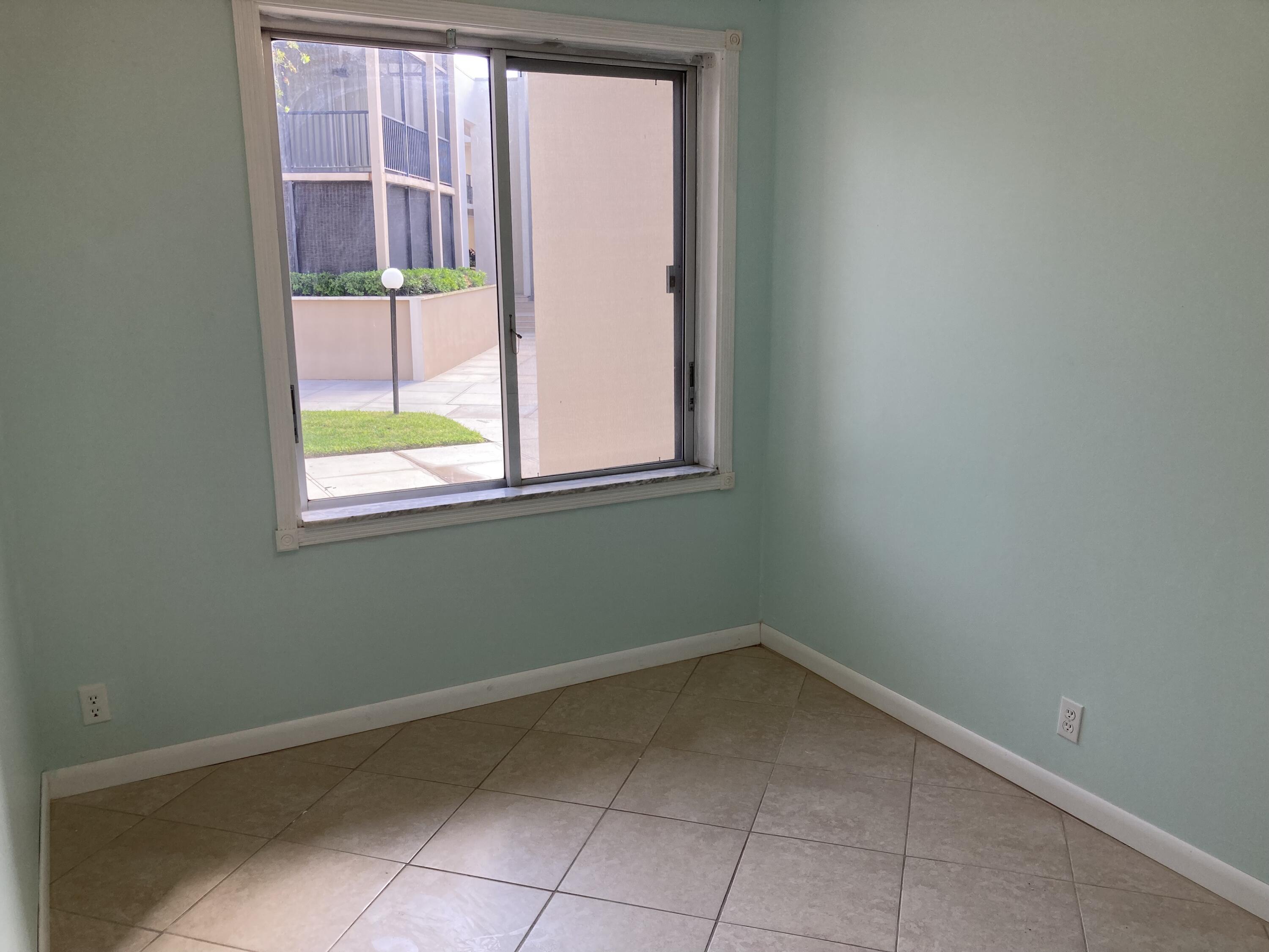 11811 Ave Of The PGA, Unit 21C Palm Beach Gardens, FL 33418 - Photo 25 of 30 a view of a room that has a window in it