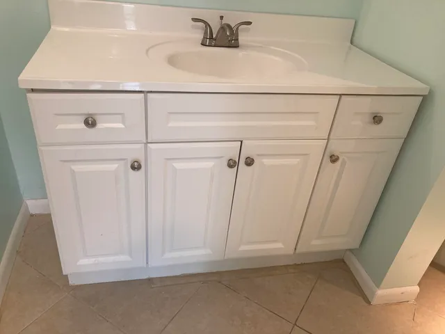 a bathroom with a sink and vanity