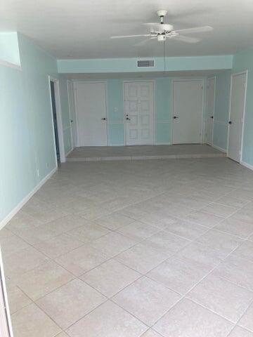 11811 Ave Of The PGA, Unit 21C Palm Beach Gardens, FL 33418 - Photo 30 of 30 an empty room with an entryway