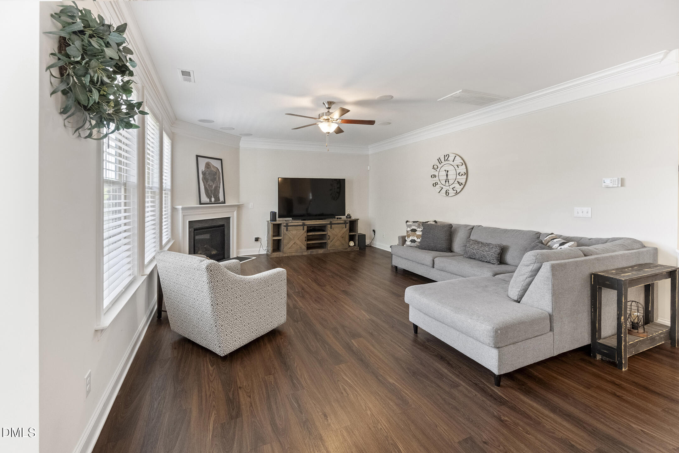 3541 Fairstone Road Wake Forest, NC 27587 - Photo 4 of 39 a living room with furniture a fireplace and a potted plant