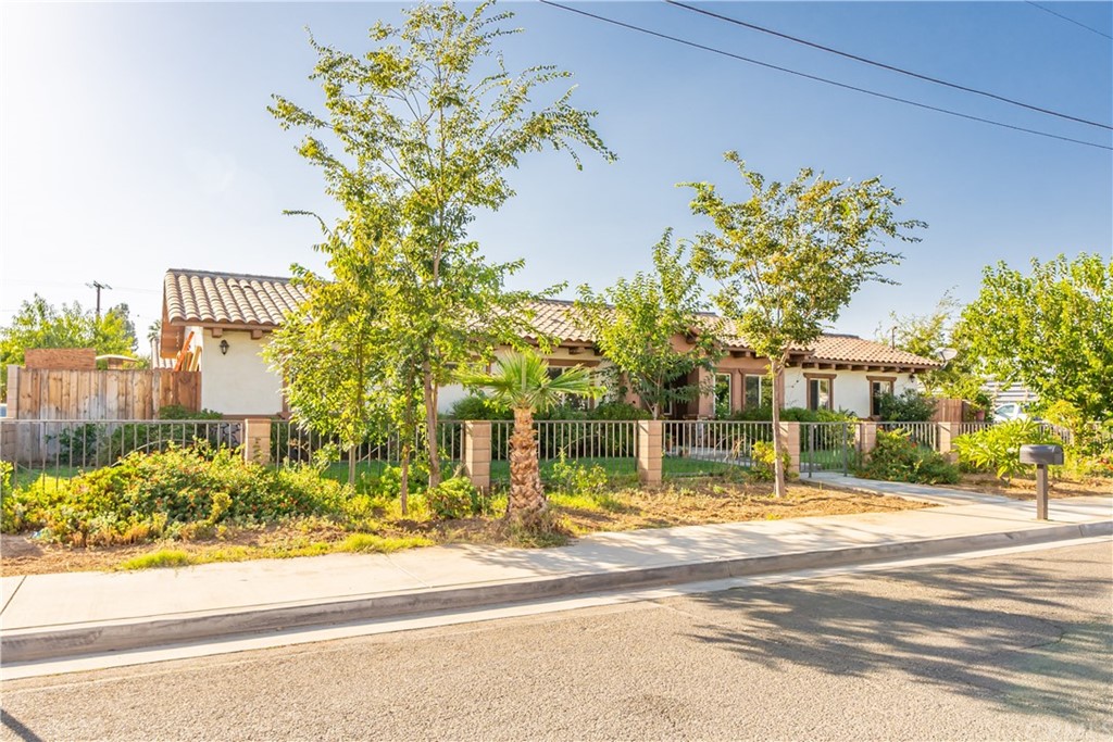 9836 Beau Avenue Riverside, CA 92503 - Photo 1 of 1 a view of street along with trees