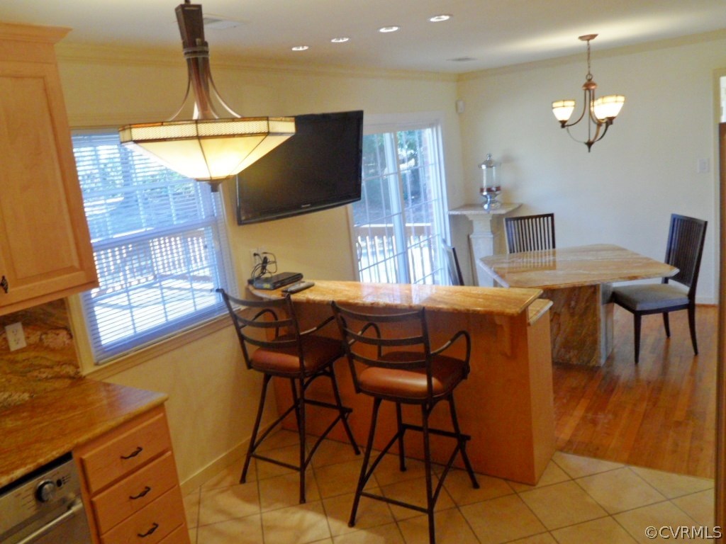 3725 Cheyenne Road Richmond, VA 23235 - Photo 11 of 24 a view of a dining room with furniture and chandelier