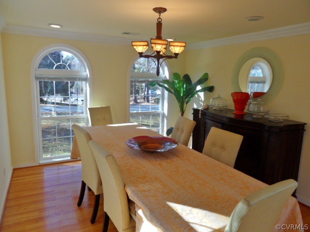 3725 Cheyenne Road Richmond, VA 23235 - Photo 13 of 24 a view of a dining room with furniture and wooden floor