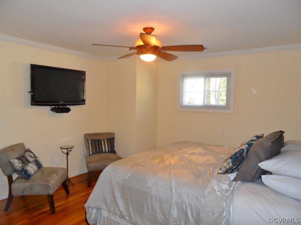 3725 Cheyenne Road Richmond, VA 23235 - Photo 21 of 24 a bedroom with a bed and a flat screen tv