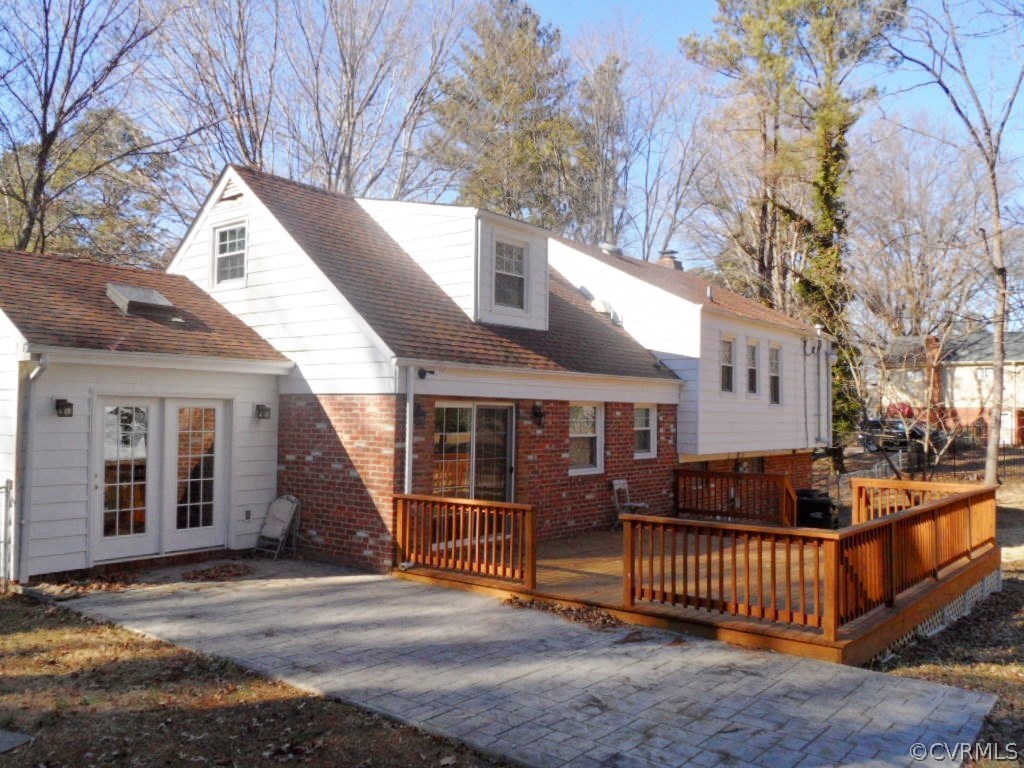 3725 Cheyenne Road Richmond, VA 23235 - Photo 23 of 24 a view of a house with a wooden fence and floor to ceiling window