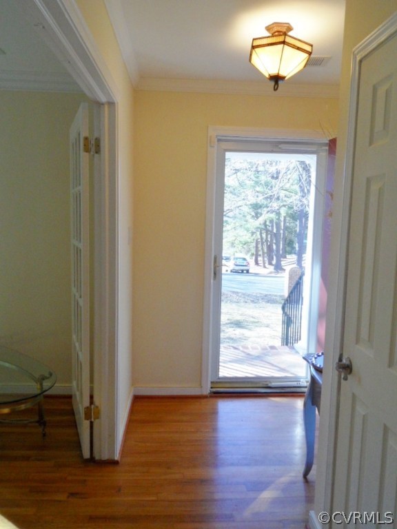 3725 Cheyenne Road Richmond, VA 23235 - Photo 5 of 24 a view of an empty room with wooden floor and a window