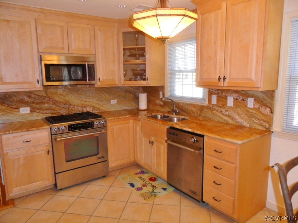 3725 Cheyenne Road Richmond, VA 23235 - Photo 9 of 24 a kitchen with stainless steel appliances a stove sink and microwave