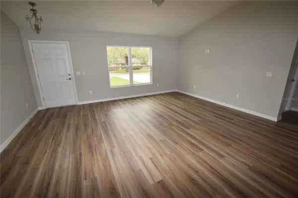 a kitchen with a sink a microwave a stove and refrigerator
