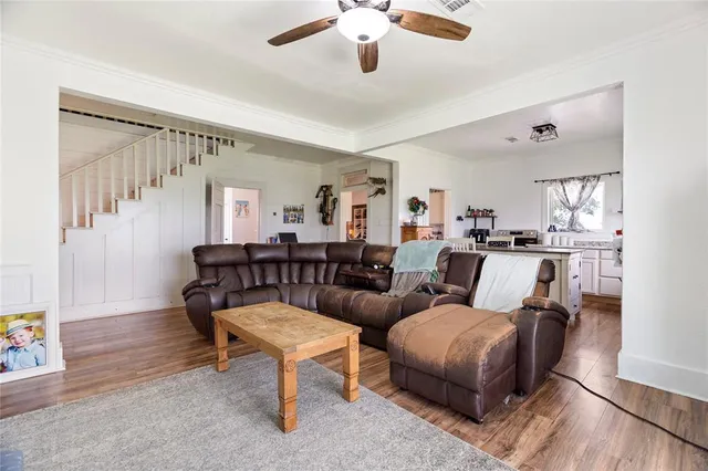 a kitchen with stainless steel appliances a stove a sink and a refrigerator