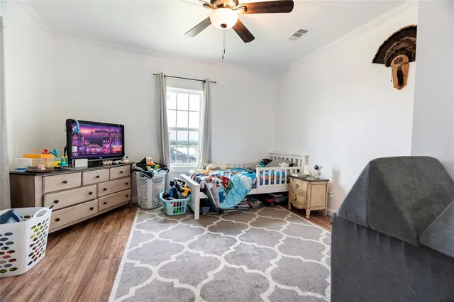 a view of a workspace with furniture and wooden floor