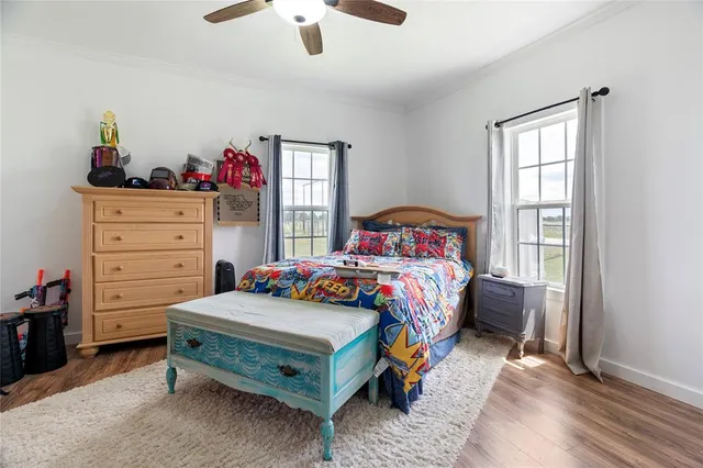 a bathroom with a sink a mirror a vanity and shower curtain