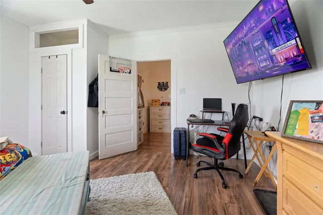 a white toilet sitting next to a bathroom sink and vanity