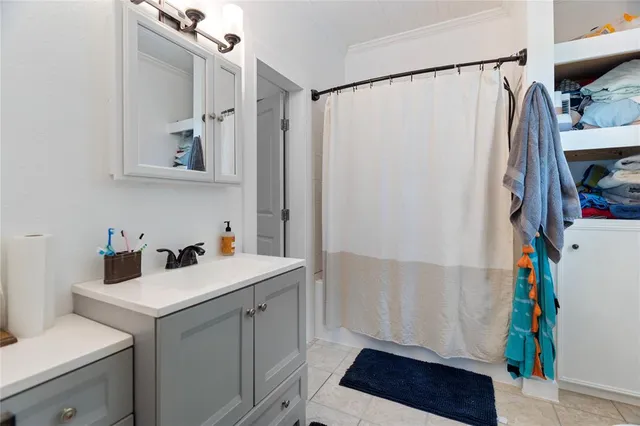 a kitchen with stainless steel appliances granite countertop a sink and wooden floor