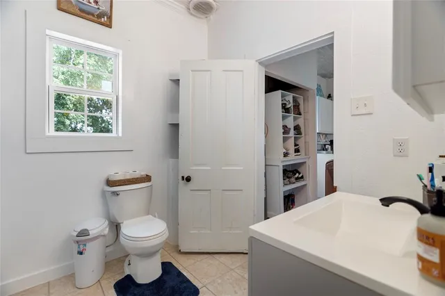 a view of a deck with table and chairs with wooden floor and fence
