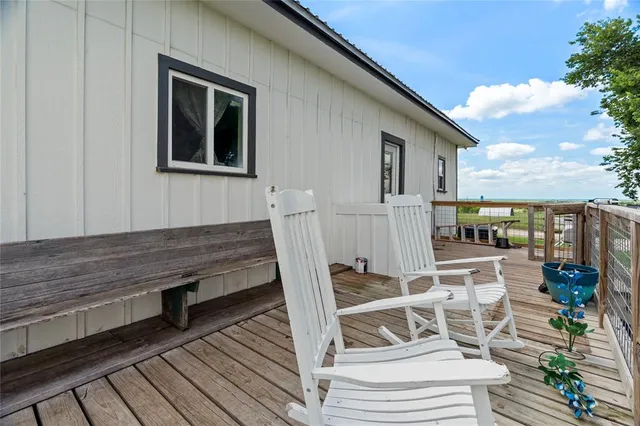a view of a house with backyard and porch