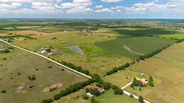 a view of a lake with a building in the background