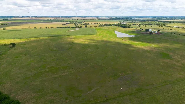 a view of a table and chairs in the garden