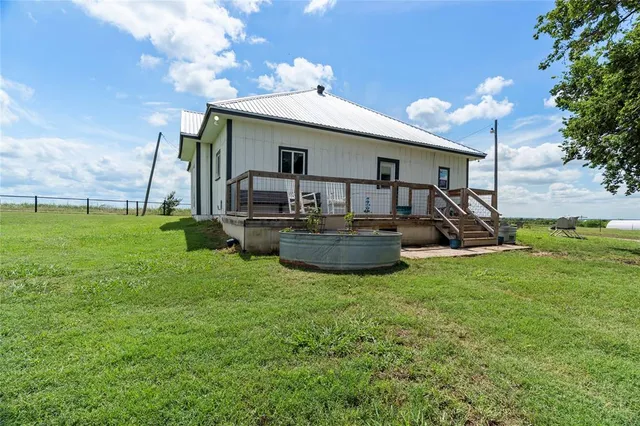 a view of a livingroom with furniture and hardwood floor