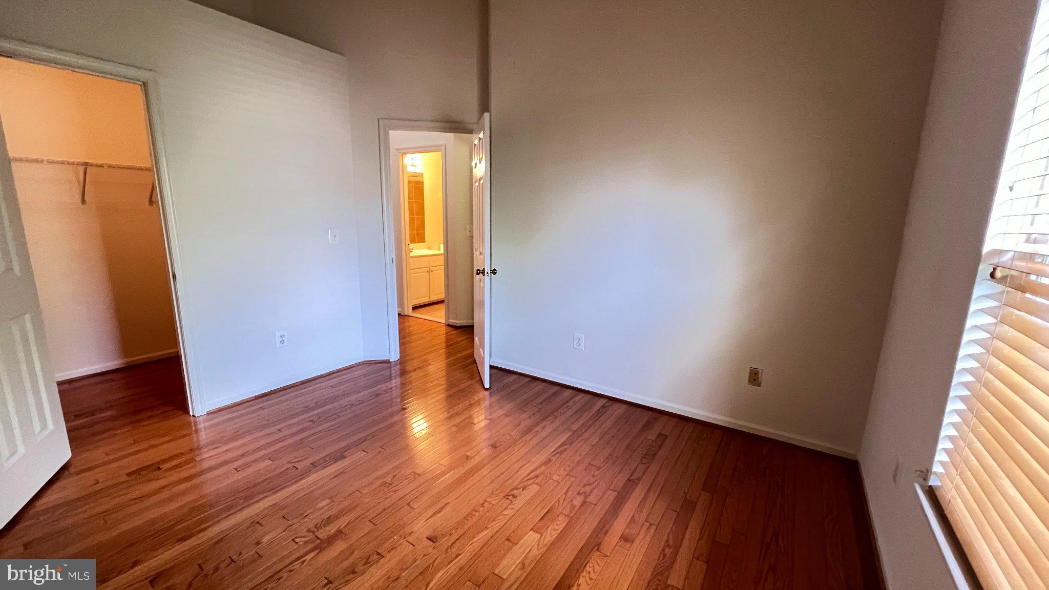 4100 Flower Fairfax, VA 22030 - Photo 27 of 47 an empty room with wooden floor and windows