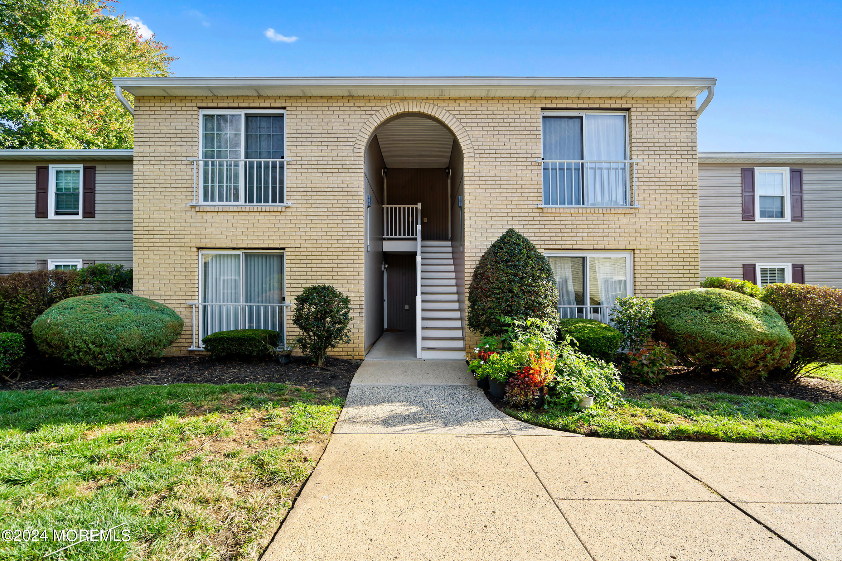 509 Harding Road, Unit 2 Freehold, NJ 07728 - Photo 1 of 24 a front view of a house with garden