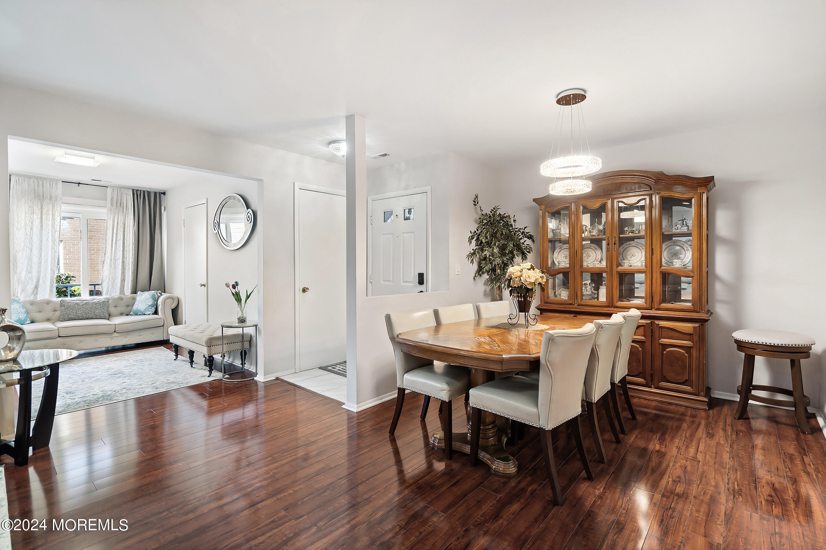 509 Harding Road, Unit 2 Freehold, NJ 07728 - Photo 12 of 24 a view of a dining room with furniture and wooden floor