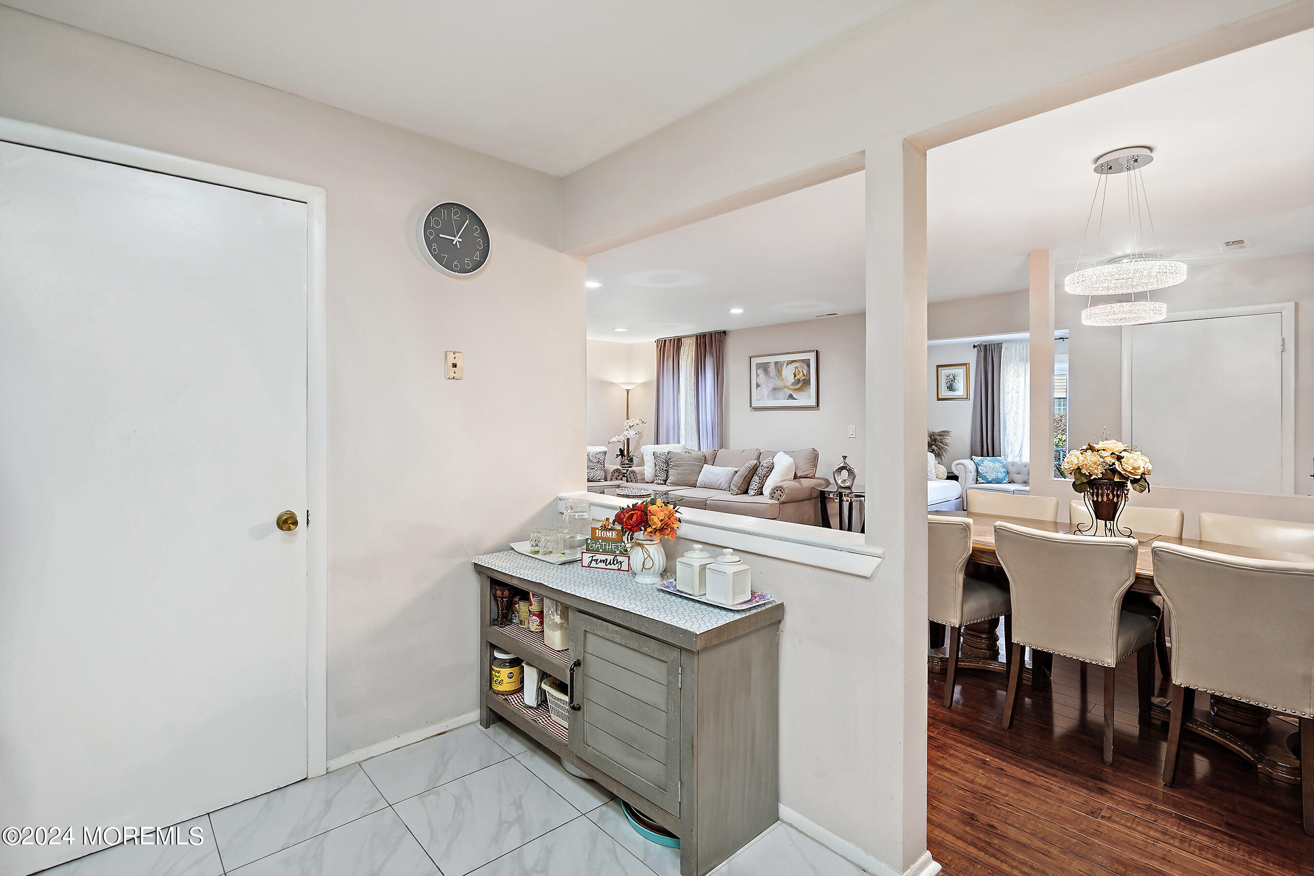 509 Harding Road, Unit 2 Freehold, NJ 07728 - Photo 16 of 24 a room with stainless steel appliances a stove a sink dishwasher and white cabinets with wooden floor