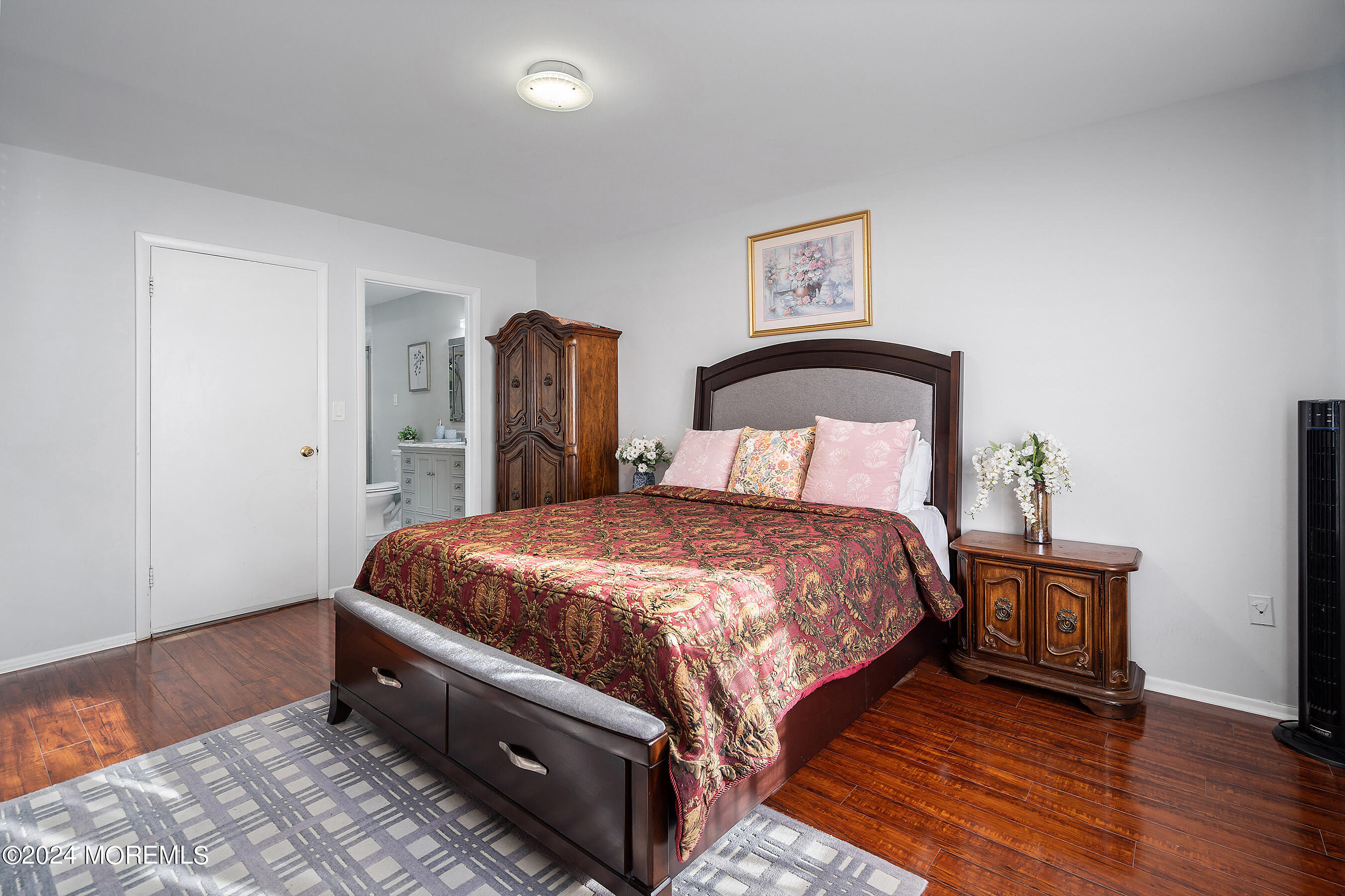 509 Harding Road, Unit 2 Freehold, NJ 07728 - Photo 19 of 24 a bedroom with a bed and wooden floor