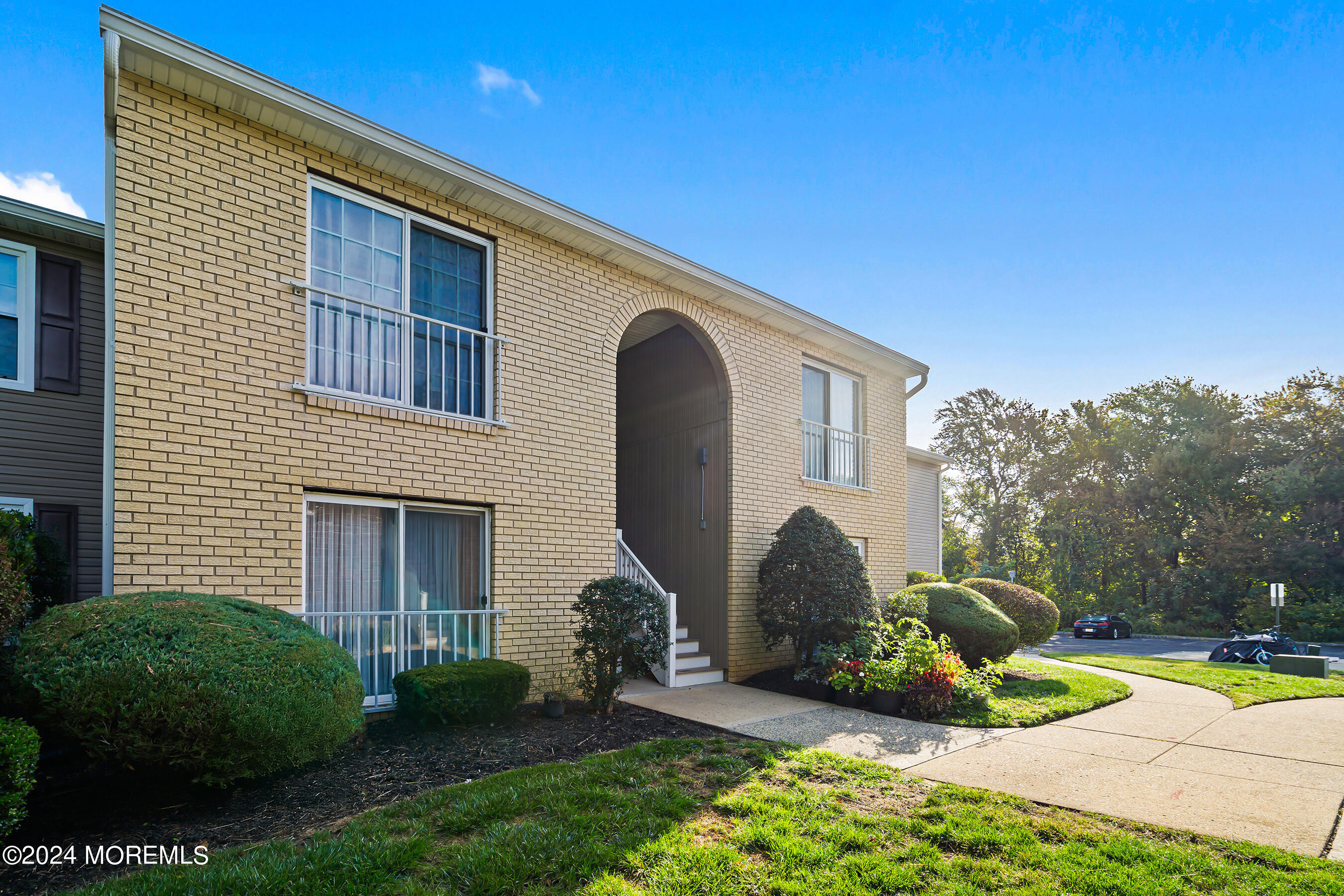 509 Harding Road, Unit 2 Freehold, NJ 07728 - Photo 3 of 24 a view of a house with backyard and sitting area