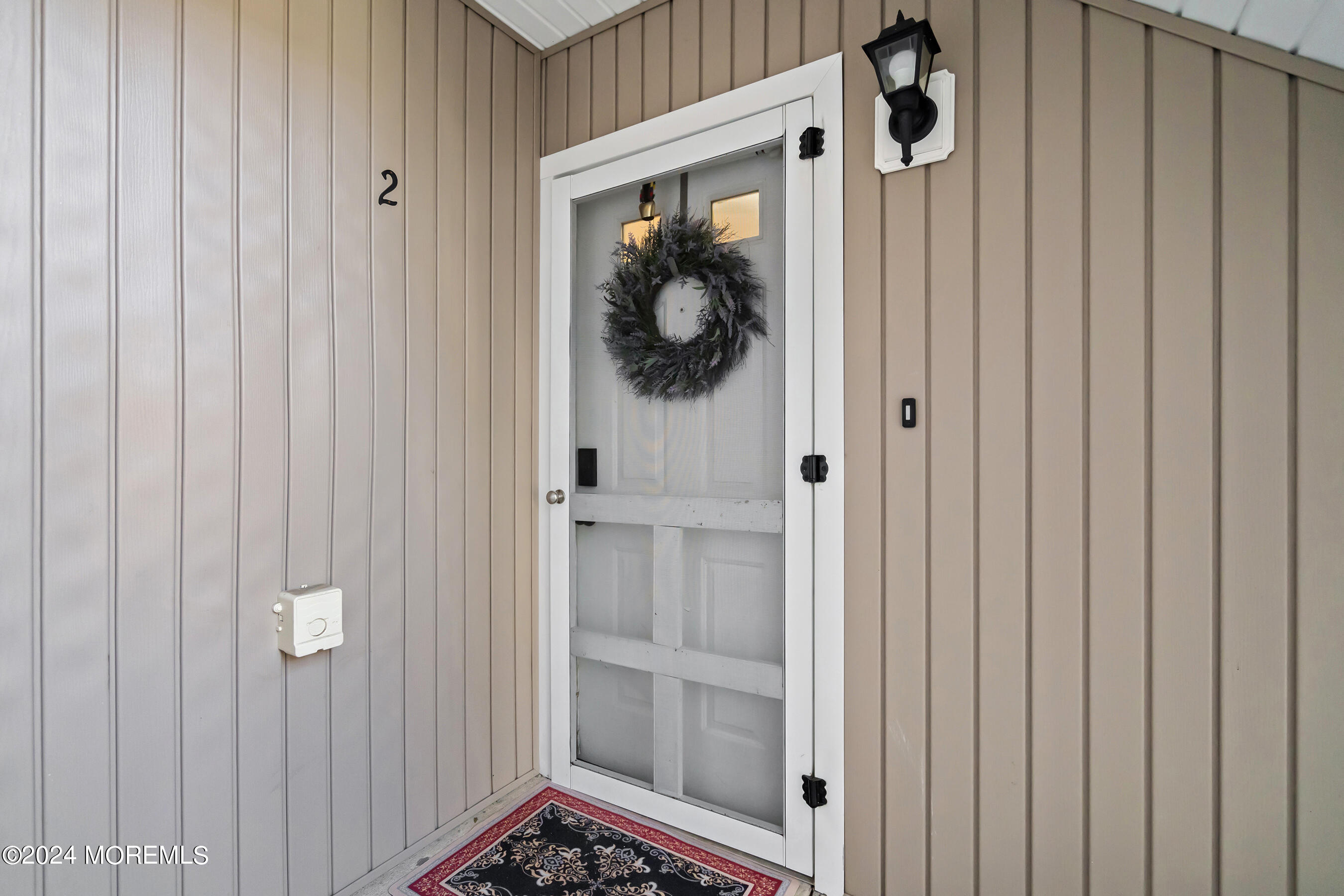 509 Harding Road, Unit 2 Freehold, NJ 07728 - Photo 4 of 24 a view of a hallway with wooden door and entryway