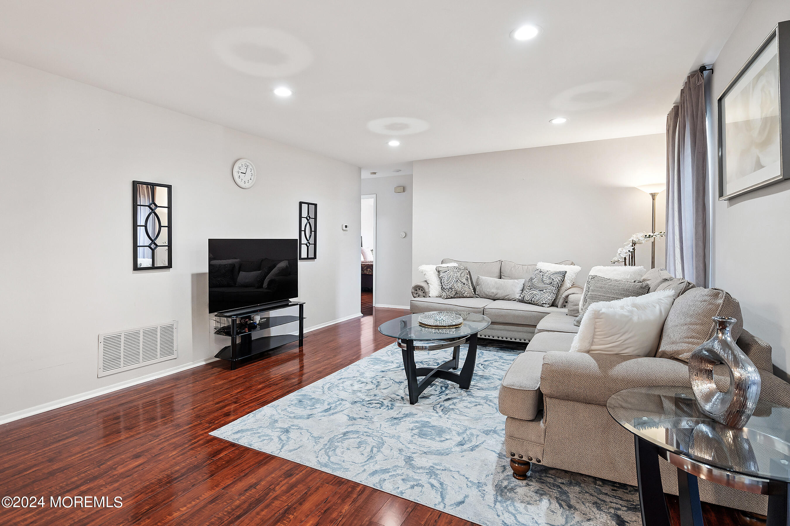 509 Harding Road, Unit 2 Freehold, NJ 07728 - Photo 8 of 24 a living room with furniture and a flat screen tv