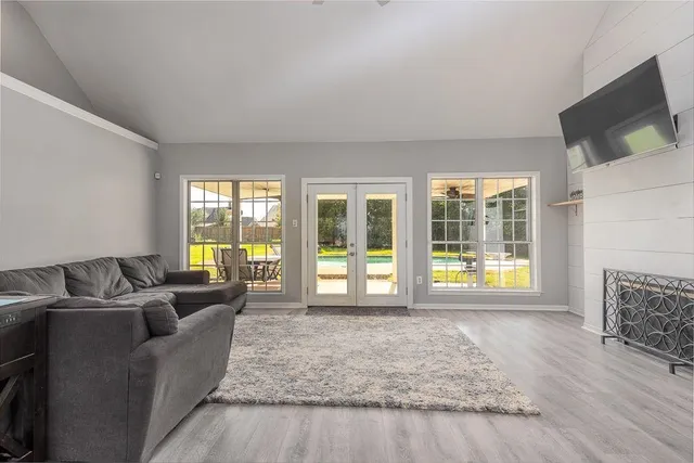 a living room with furniture and a flat screen tv