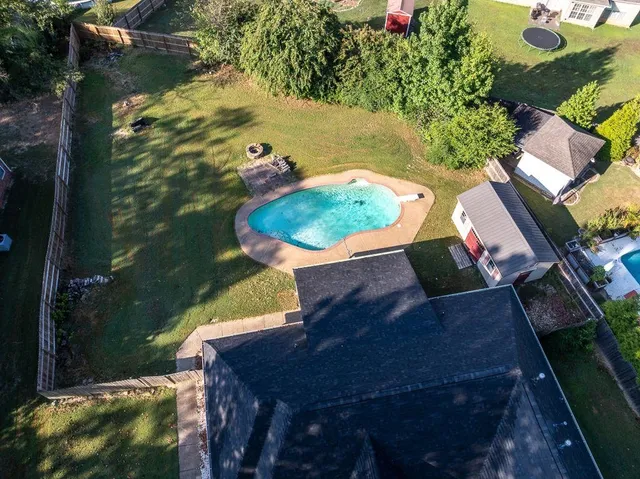 an aerial view of residential house with outdoor space