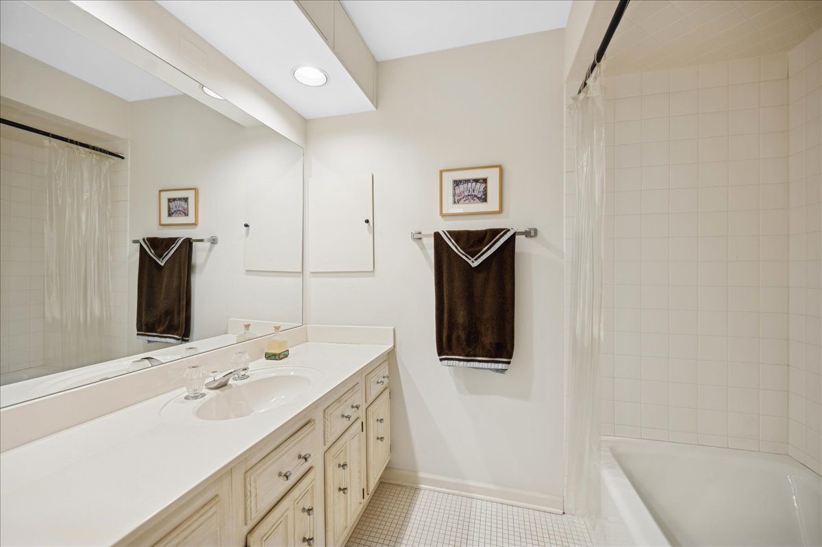 1771 Mission Hills Road, Unit 212 Northbrook, IL 60062 - Photo 20 of 22 a bathroom with a sink and a mirror