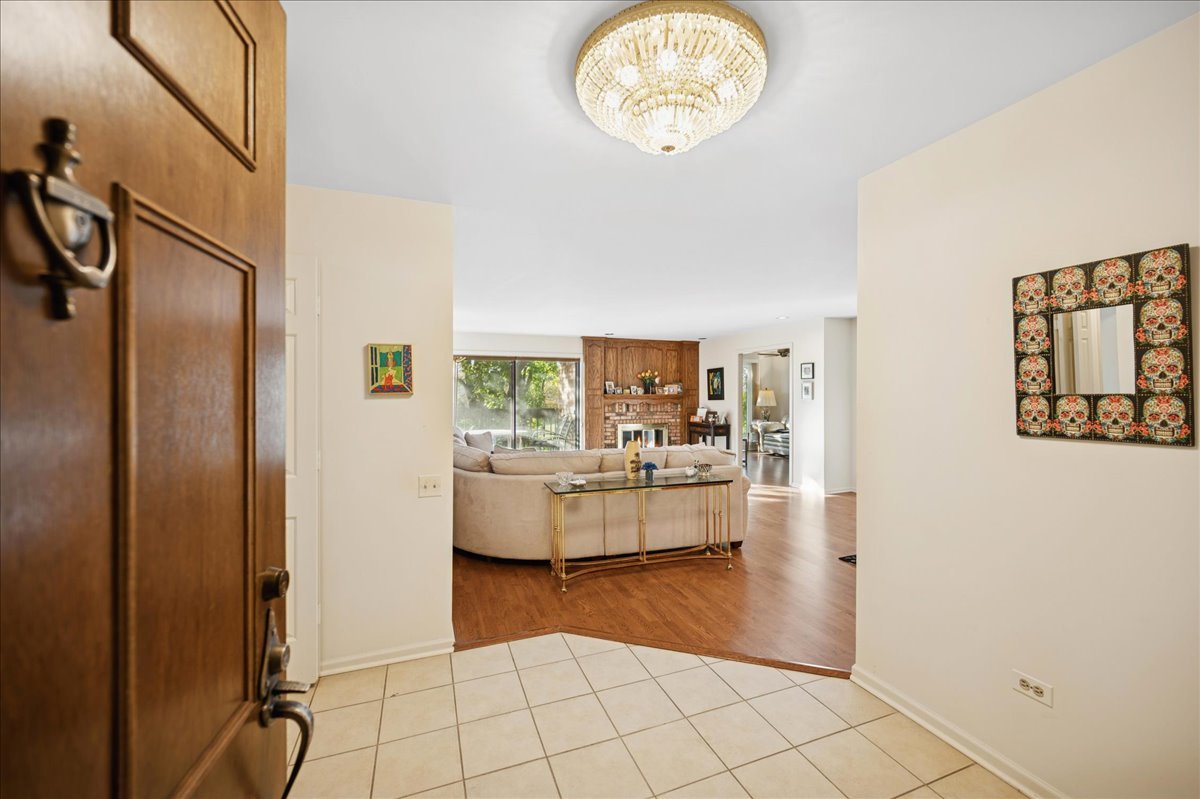 1771 Mission Hills Road, Unit 212 Northbrook, IL 60062 - Photo 2 of 22 a view of living room filled with furniture and window
