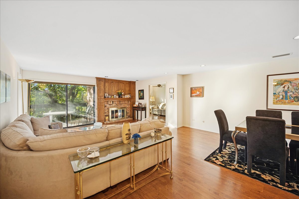 1771 Mission Hills Road, Unit 212 Northbrook, IL 60062 - Photo 3 of 22 a living room with furniture and a flat screen tv