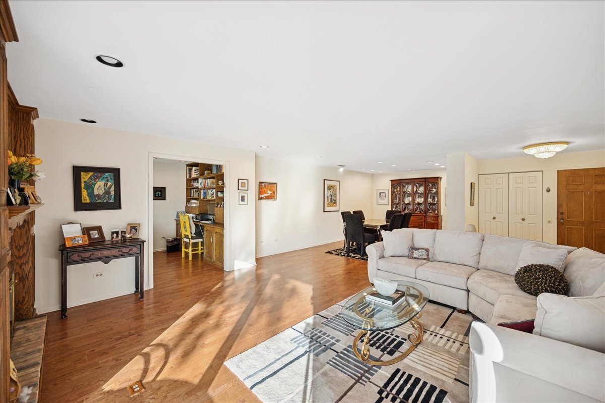 1771 Mission Hills Road, Unit 212 Northbrook, IL 60062 - Photo 4 of 22 a living room with furniture and a wooden floor