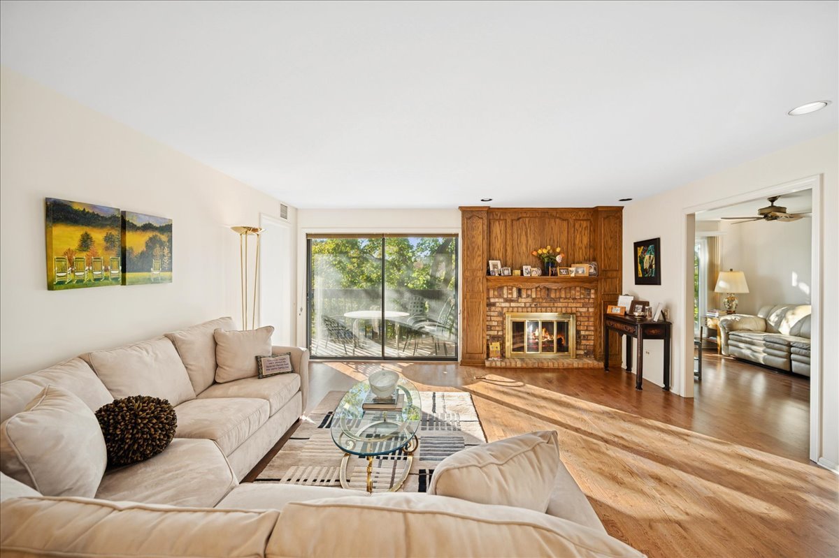 1771 Mission Hills Road, Unit 212 Northbrook, IL 60062 - Photo 5 of 22 a living room with furniture and a large window