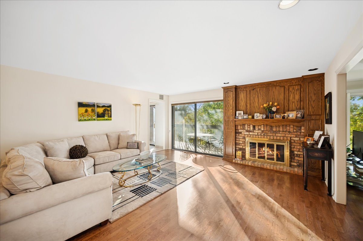 1771 Mission Hills Road, Unit 212 Northbrook, IL 60062 - Photo 6 of 22 a living room with furniture and a flat screen tv