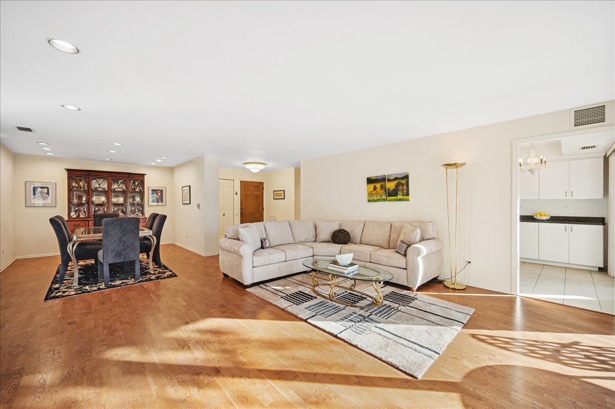 1771 Mission Hills Road, Unit 212 Northbrook, IL 60062 - Photo 7 of 22 a living room with furniture and a table