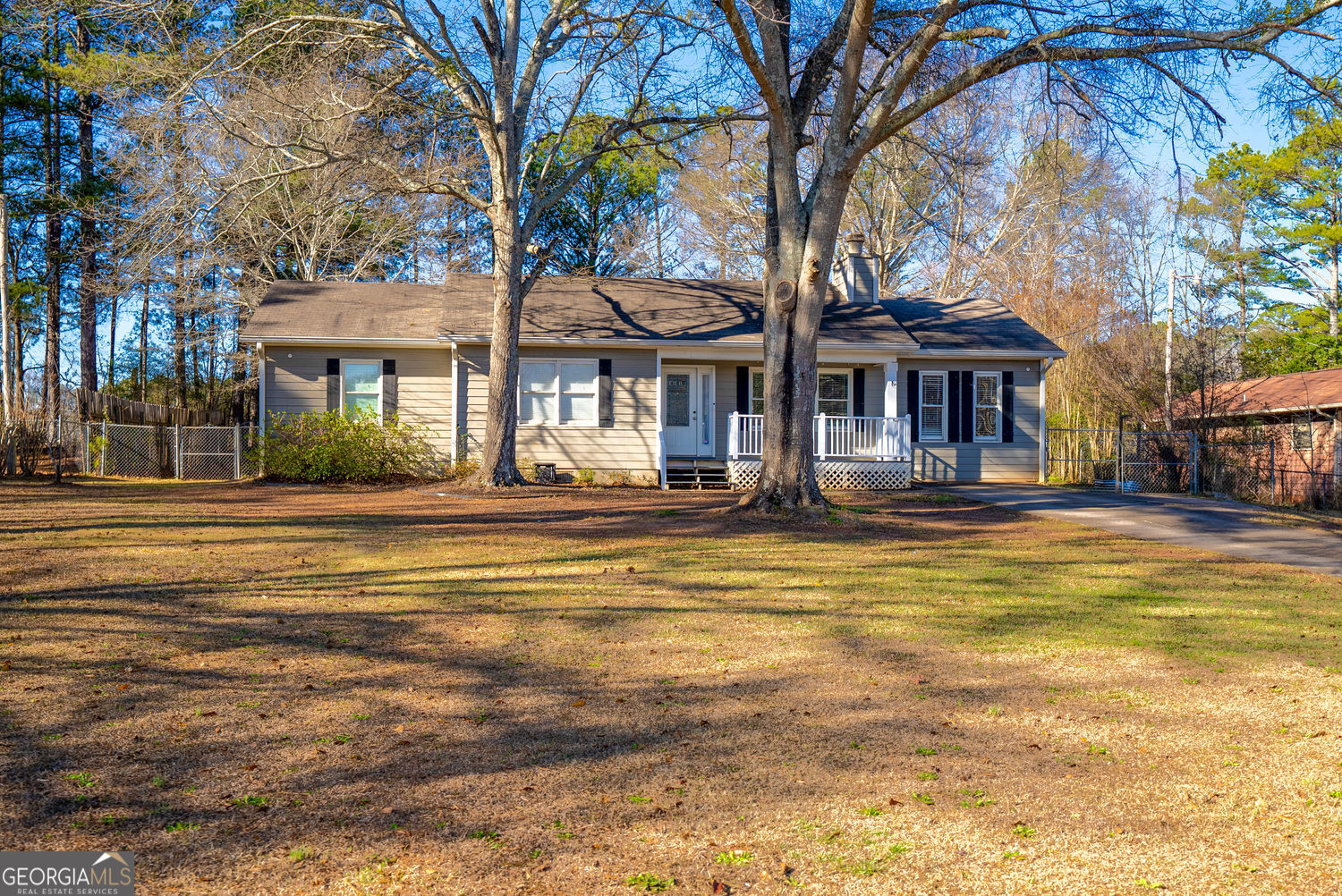 707 Reese Street Monroe, GA 30655 - Photo 1 of 1 a front view of a house with a large trees