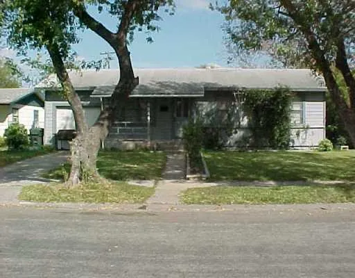 a backyard of a house with yard and garage