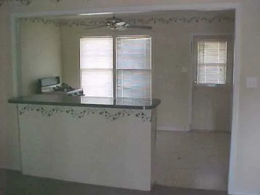 a bathroom with a sink and a window