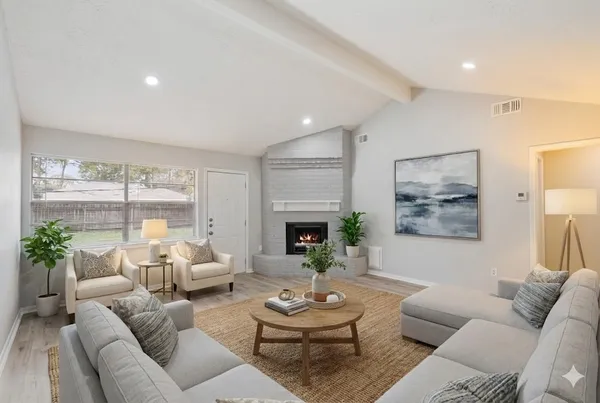a living room with furniture and a large window