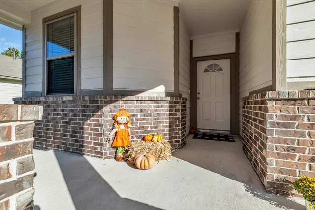 a front view of a house with a yard and outdoor seating