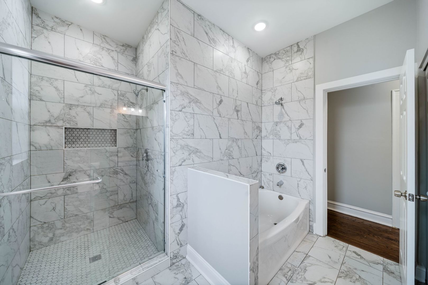 5426 West Jackson Boulevard, Unit 2 Chicago, IL 60644 - Photo 8 of 10 a bathroom with a bathtub and a shower